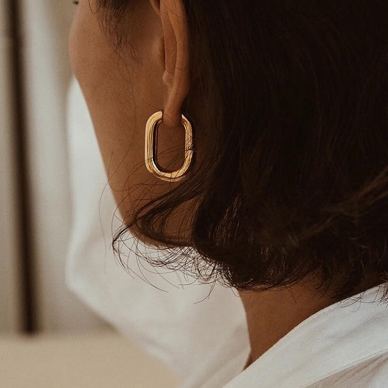 boucle - d'oreille - dorée - femme 